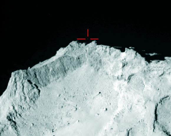 OSIRIS instrument on the Rosetta spacecraft captured this image of Comet 67P/Churyumov–Gerasimenko on November 12, 2014; marked is what Rosetta scientists believe to be the Philae lander above the rim of the large depression – named Hatmehit – on the comet’s small lobe. Image credit: ESA / Rosetta / MPS for OSIRIS team / UPD / LAM / IAA / SSO / INTA / UPM / DASP / IDA.