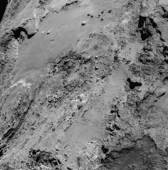 Four-image mosaic of Comet 67P/Churyumov-Gerasimenko comprising images taken on 14 February 2015 during the first dedicated close flyby; this image set was taken from a distance of 8.9 km. Image credit: ESA / Rosetta / NavCam / CC BY-SA IGO 3.0.