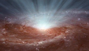 Supermassive black holes at the cores of galaxies blast radiation and ultra-fast winds outward, as illustrated in this artist's conception, based on an image of the Pinwheel galaxy from Hubble. Image credit: NASA / JPL-Caltech.