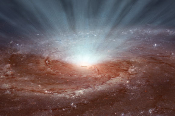 Supermassive black holes at the cores of galaxies blast radiation and ultra-fast winds outward, as illustrated in this artist's conception, based on an image of the Pinwheel galaxy from Hubble. Image credit: NASA / JPL-Caltech.