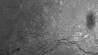 Close view of a 228 x 228 m region on 67P/Churyumov-Gerasimenko was taken 6 km above the surface. Rosetta’s fuzzy shadow, measuring about 20 x 50 m, is seen on the right of the image. Image credit: ESA / Rosetta / MPS for OSIRIS Team / UPD / LAM / IAA / SSO / INTA / UPM / DASP / IDA.