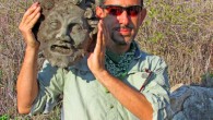 University of Haifa archaeologist with the bronze mask of Pan. Image credit: Michael Eisenberg.