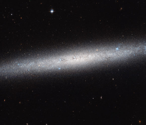 NGC 5023 is seen edge-on in this new image from NASA/ESA Hubble Space Telescope. Image credit: ESA / Hubble / NASA.