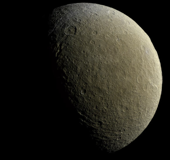 This mosaic image from the NASA/ESA/ASI Cassini-Huygens spacecraft is centered at 9 degrees north latitude, 254 degrees west longitude. The image was acquired at a distance of about 57,800 km from Rhea. This image represents one of the highest resolution color views of the icy moon released to date, and consists of multiple images from Cassini’s narrow-angle camera (NAC) with data from the wide-angle camera used to fill in areas where NAC data was not available. Image credit: NASA / JPL-Caltech / Space Science Institute.
