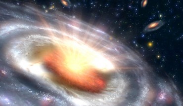 A growing black hole can be seen at the center of a faraway galaxy in this artist’s concept. Image credit: NASA / JPL-Caltech.