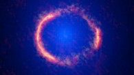 This composite image shows the gravitationally lensed galaxy SDP.81; the bright orange central region of the ring reveals the glowing dust in this distant galaxy; the surrounding lower-resolution portions of the ring trace the millimeter wavelength light emitted by carbon monoxide; the diffuse blue element at the center of the ring is from the intervening lensing galaxy. Image credit: ALMA / NRAO / ESO / NAOJ / B. Saxton / AUI / NSF / NASA / ESA / Hubble / T. Hunter.