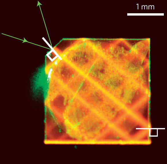 Laser light enters a synthetic diamond from a facet at its corner and bounces around inside the diamond until its energy is exhausted; this excites the NVs that can be used to measure magnetic fields. Image credit: H. Clevenson / MIT Lincoln Laboratory.