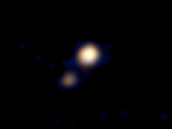 This image from the New Horizons shows Pluto and Charon. It was made from a distance of about 71 million miles (115 million kilometers) - roughly the distance from the Sun to Venus. At this distance, neither Pluto nor Charon is well resolved by the color imager, but their distinctly different appearances can be seen. Image credit: NASA / Johns Hopkins University Applied Physics Laboratory / Southwest Research Institute.