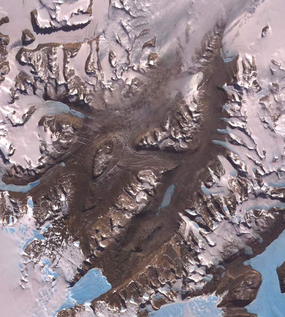 The McMurdo Dry Valleys are a row of valleys west of McMurdo Sound, Antarctica, so named because of their extremely low humidity and lack of snow and ice cover. Photosynthetic bacteria have been found living in the relatively moist interior of rocks. Scientists consider the Dry Valleys to be the closest of any terrestrial environment to Mars. Image credit: NASA / GSFC / METI / ERSDAC / JAROS / ASTER Science Team.