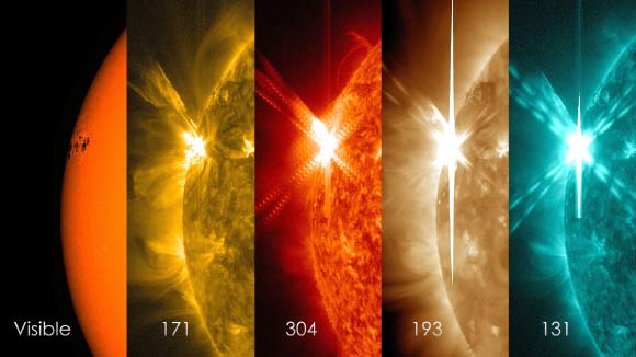 NASA’s Solar Dynamics Observatory captured these images of a solar flare – as seen in the bright flash on the left – on May 5, 2015. From left to right, the wavelengths are: visible light, 171 Angstroms, 304 Angstroms, 193 Angstroms and 131 Angstroms. Each wavelength has been colorized. Image credit: NASA / GSFC / SDO.