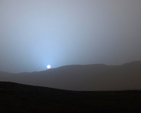 NASA’s Curiosity Mars rover captured this beautiful view of nightfall on the Red Planet on April 15, 2015. The red surface coloring of Mars is due to oxidized iron. At certain times of the Martian year, great dust storms occur; the large amounts of dust in the atmosphere during these storms absorb much of the incoming radiation from the Sun; this causes large temperature inversions in the Martian atmosphere. Image credit: NASA / JPL-Caltech / MSSS.