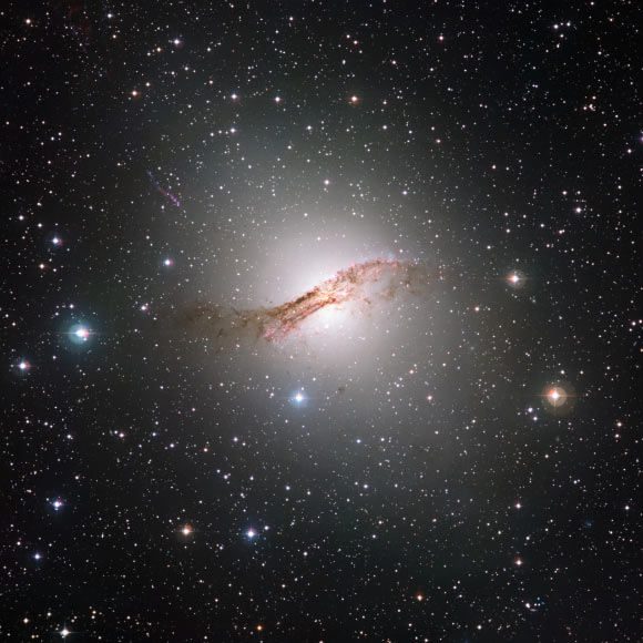 The giant elliptical galaxy Centaurus A (NGC 5128) is the closest such galaxy to the Earth, at a distance of about 12 million light-years. Image credit: ESO / ESA / Hubble / NASA / Digitized Sky Survey / Davide de Martin.