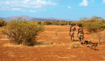Two Hadza men return from a hunt. The Hadza people are one of the last hunter-gatherer tribes left in Africa. Image credit: Andreas Lederer / CC BY 2.0.