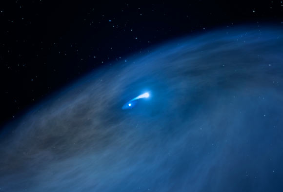 This illustration reveals a vast disk of gas surrounding the Wolf-Rayet star Nasty 1, shown at center. A close companion star is pulling gas from the star, shown by the bridge of bright material connecting the two stars. This act of celestial cannibalism exposes the massive star’s hot, helium core. Some of the material, however, is escaping into space, forming the huge disk. This disk structure has never been seen before around a Wolf-Rayet star. Image credit: NASA / ESA / G. Bacon, STScI. 