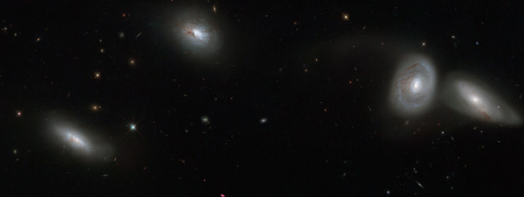 This Hubble image shows (from left to right) NGC 839, NGC 838, NGC 835, and NGC 833 galaxies. Image credit: NASA / ESA / ESO / Jane Charlton, Pennsylvania State University.