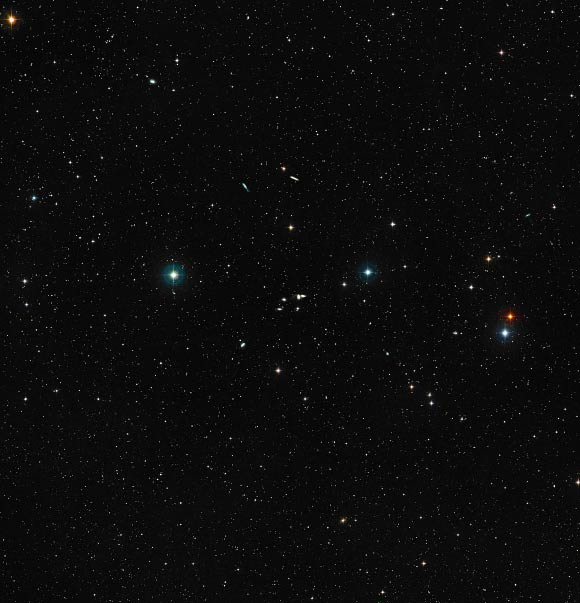 This image shows a ground-based wide-field view of the region around HCG 16. Image credit: NASA / ESA / Digitized Sky Survey 2 / Davide De Martin.