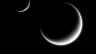 This image shows Saturn’s moons Titan, Mimas (center bottom) and Rhea (upper left). Image credit: NASA / JPL-Caltech / Space Science Institute.