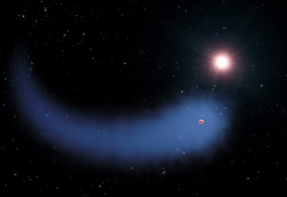 This artist’s concept shows the huge cloud of hydrogen bleeding off of the Neptune-sized exoplanet Gliese 436b. Image credit: NASA / ESA / STScI / G. Bacon.