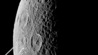 This image was taken in visible light with the Cassini spacecraft narrow-angle camera on June 16, 2015. The bright rings of Saturn can be seen at left. North on Dione is up and rotated 44 degrees to the left. Image credit: NASA / JPL-Caltech / Space Science Institute.