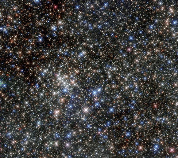This new Hubble image shows a massive open star cluster known as the Quintuplet Cluster in infrared light. Image credit: ESA / Hubble / NASA.
