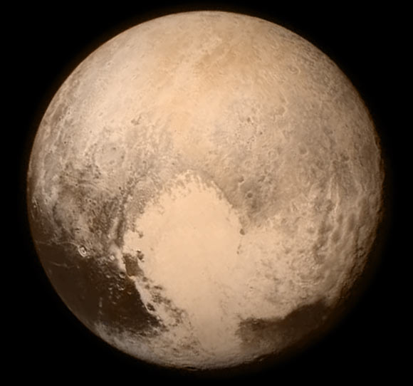 Pluto nearly fills the frame in this image from NASA’s New Horizons spacecraft, taken on July 13, 2015, when the spacecraft was 476,000 miles (768,000 km) from the dwarf planet’s surface. This is the last and most detailed image sent to Earth before the spacecraft’s closest approach to Pluto on July 14. The color image has been combined with lower-resolution color information from the Ralph instrument that was acquired earlier on July 13. This view is dominated by the large, bright feature informally named the ‘heart,’ which measures around 1,000 miles (1,600 km) across. The heart’s diameter is about the same distance as from Denver to Chicago, in America’s heartland.  The heart borders darker equatorial terrains, and the mottled terrain to its east (right) are complex. However, even at this resolution, much of the heart’s interior appears remarkably featureless-possibly a sign of ongoing geologic processes. Image credit: NASA / Johns Hopkins University Applied Physics Laboratory / Southwest Research Institute.