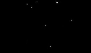 This image of Pluto (center) was taken on July 14, 2015 from a distance of 2.4 billion miles (3.9 billion km). Image credit: NASA / JPL-Caltech / Space Science Institute.