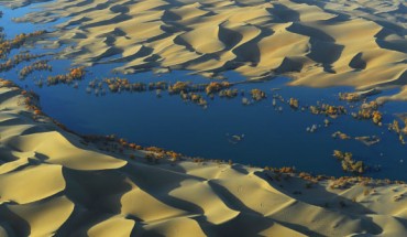 Dr Yan Li and co-authors followed the journey of water through the Tarim Basin from the rivers at the edge of the valley to the desert aquifers under the basin. They found that as water moved through irrigated fields, the water gathered dissolved carbon and moved it deep underground. Image credit: Yan Li.