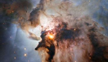 This Hubble image shows the center of the Lagoon Nebula. The region is filled with intense winds from hot stars, churning funnels of gas, and energetic star formation, all embedded within an intricate haze of gas and pitch-dark dust. Image credit: NASA / ESA / J. Trauger, JPL.