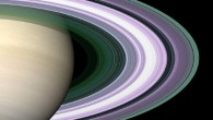 In this simulated image of Saturn’s rings, color is used to present information about ring particle sizes in different regions based on the measured attenuations of three radio signals. Image credit: NASA.