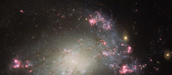 The object in this Hubble image is a barred spiral galaxy called NGC 428. Image credit: NASA / ESA / Hubble / S. Smartt, Queen’s University Belfast.