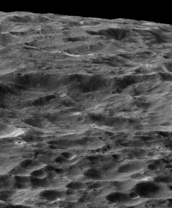 Cassini gazes out upon a rolling, cratered landscape in this oblique view of Dione. A record of impacts large and small is preserved in the moon’s ancient, icy surface. The image was obtained in visible light with Cassini’s wide-angle camera during a close flyby of the moon on August 17. The view was acquired at an altitude of approximately 470 miles (750 km) above Dione. North on Dione is down. Image credit: NASA / JPL-Caltech / Space Science Institute.