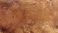A noticeable feature of the Atlantis basin is the several hundred mesas and small peaks strewn ‘chaotically’ across its roughly 200-km expanse. The uppermost layer of these elevated areas consists of light-colored material. Spectroscopic measurements have shown these consist of phyllosilicates, minerals produced in the presence of water. Image credit: ESA / DLR / FU Berlin / CC BY-SA 3.0 IGO.