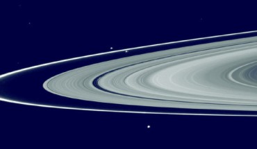 This composite image shows Saturn’s main rings, the F ring, and its shepherd satellites: the narrow F ring is located just outside of the outer edge of the main rings; slightly above and to the left of the center of the image are the shepherd satellites Prometheus (inner orbit) and Pandora (outer orbit). Image credit: NASA.