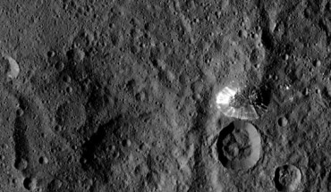 Dawn spotted this conical mountain on Ceres from a distance of 915 miles (1,470 km). The image was taken on August 19, 2015. The mountain, located in the southern hemisphere, stands 4 miles (6 km) high. Its perimeter is sharply defined, with almost no accumulated debris at the base of the brightly streaked slope. Image credit: NASA / JPL-Caltech / UCLA / MPS / DLR / IDA.