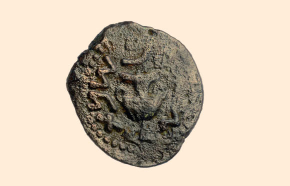 A bronze coin found near the structure. Image credit: Carla Amit / Israel Antiquities Authority.