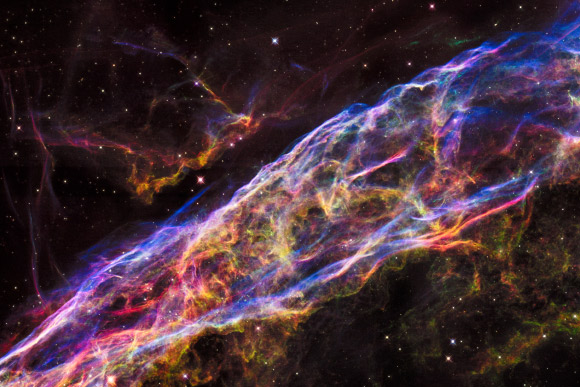 This Hubble image shows a small section of the Veil Nebula. This section of the outer shell of the famous supernova remnant is in a region known as the Witch’s Broom Nebula (NGC 6960). Image credit: NASA / ESA / Hubble Heritage Team.