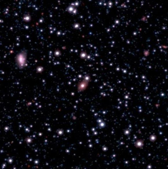 Vista Magellanic Clouds Survey view of the galaxy SAGE0536AGN (elliptical object in the center of the frame). Image credit: ESO / VISTA Magellanic Cloud Survey / Royal Astronomical Society.