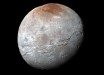 This impressive view of Charon was captured on July 14, 2015. Charon’s color palette is not as diverse as Pluto’s; most striking is the reddish north (top) polar region, informally named Mordor Macula. Image credit: NASA / Johns Hopkins University Applied Physics Laboratory / Southwest Research Institute.