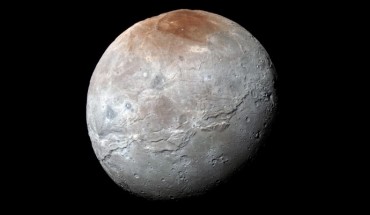 This impressive view of Charon was captured on July 14, 2015. Charon’s color palette is not as diverse as Pluto’s; most striking is the reddish north (top) polar region, informally named Mordor Macula. Image credit: NASA / Johns Hopkins University Applied Physics Laboratory / Southwest Research Institute.