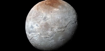 This impressive view of Charon was captured on July 14, 2015. Charon’s color palette is not as diverse as Pluto’s; most striking is the reddish north (top) polar region, informally named Mordor Macula. Image credit: NASA / Johns Hopkins University Applied Physics Laboratory / Southwest Research Institute.