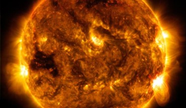 SDO captured this image of an M5.5 class flare - as seen in the bright flash on the lower right limb of the Sun - on October 1. Image credit: NASA / SDO.