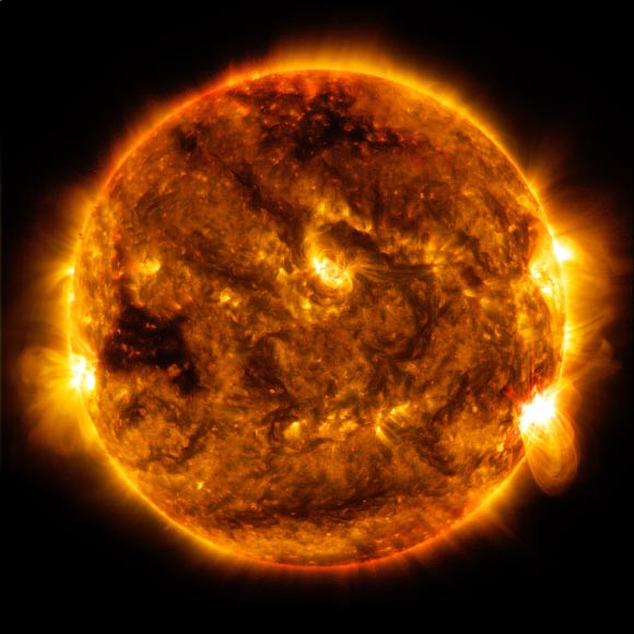 SDO captured this image of an M5.5 class flare - as seen in the bright flash on the lower right limb of the Sun - on October 1. Image credit: NASA / SDO.