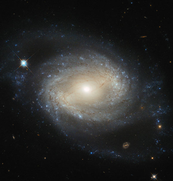 This Hubble image shows the barred spiral galaxy NGC 4639. Image credit: NASA / ESA / Hubble.