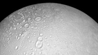 This image from Cassini shows battered terrain around the north pole of Enceladus. Craters crowd and overlap each other, each one recording an impact in the moon’s distant past. The moon’s north pole lies approximately at the top of this image. North on Enceladus is up. The view was acquired at a distance of 4,000 miles (6,000 km) from Enceladus and at a Sun-Enceladus-spacecraft, or phase, angle of 8 degrees. Image credit: NASA / JPL-Caltech / Space Science Institute.