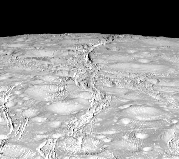 Cassini captured this stunning image of Enceladus’ north pole on October 14, 2015. Mission scientists expected the north polar region to be heavily cratered, based on low-resolution images from the Voyager mission, but high-resolution Cassini images show a landscape of stark contrasts. Thin cracks cross over the pole - the northernmost extent of a global system of such fractures. Before this Cassini flyby, scientists did not know if the fractures extended so far north on Enceladus. North on Enceladus is up. The view was acquired at a distance of 4,000 miles (6,000 km) from Enceladus and at a Sun-Enceladus-spacecraft, or phase, angle of 9 degrees. Image credit: NASA / JPL-Caltech / Space Science Institute.