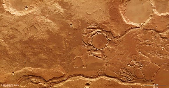 This image of part of the Mangala Valles outflow channel system was acquired by ESA’s Mars Express on July 12, 2015. The region has been subject to intense episodes of flooding, likely triggered by volcanic processes occurring in the nearby Tharsis region. Image credit: ESA / DLR / FU Berlin / CC BY-SA 3.0 IGO.