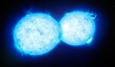 This artist’s impression shows VFTS 352 - the hottest and most massive double star system to date where the two components are in contact and sharing material. Image credit: ESO / L. Calçada.