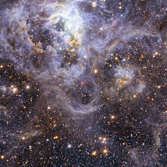 This image shows the location of VFTS 352.  This view of the Tarantula star-forming region includes visible-light images from the Wide Field Imager at the MPG/ESO 2.2-m telescope at La Silla and infrared images from the 4.1-m infrared VISTA telescope at Paranal. Image credit: ESO / M.-R. Cioni / VISTA Magellanic Cloud survey / Cambridge Astronomical Survey Unit.