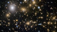 New images from the NASA/ESA Hubble Space Telescope show the faintest and earliest known galaxies in the Universe. This image shows the galaxy cluster MACSJ0717.5+3745 (MACS0717). It is one of the most massive galaxy clusters known, and it is also the largest known gravitational lens. Of all of the galaxy clusters known and measured, this cluster lenses the largest area of the sky. Image credit: NASA / ESA / HST Frontier Fields Team / STScI.
