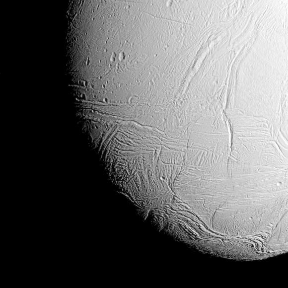 This image from Cassini shows the south polar region of Enceladus. The wavy boundary of the moon’s south polar region is visible at bottom, where it disappears into wintry darkness. The image was taken at a distance of approximately 38,000 miles (61,000 km) from Enceladus and at a Sun-Enceladus-spacecraft, or phase, angle of 42 degrees. Image credit: NASA / JPL-Caltech / Space Science Institute.